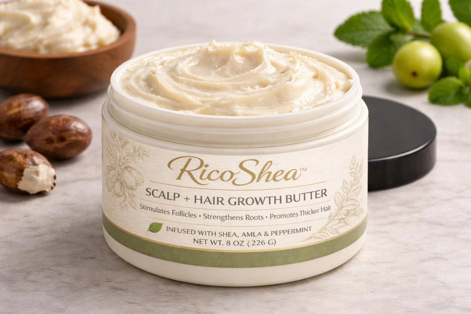 RicoShea scalp and hair growth butter in an open jar showing texture on a wooden surface with ingredients around